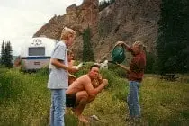 Family taking a camp shower