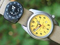 Mini compass stays secured to outdoor gear or a watch band via a clip