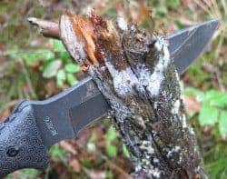 Survival Knife Cutting Wood